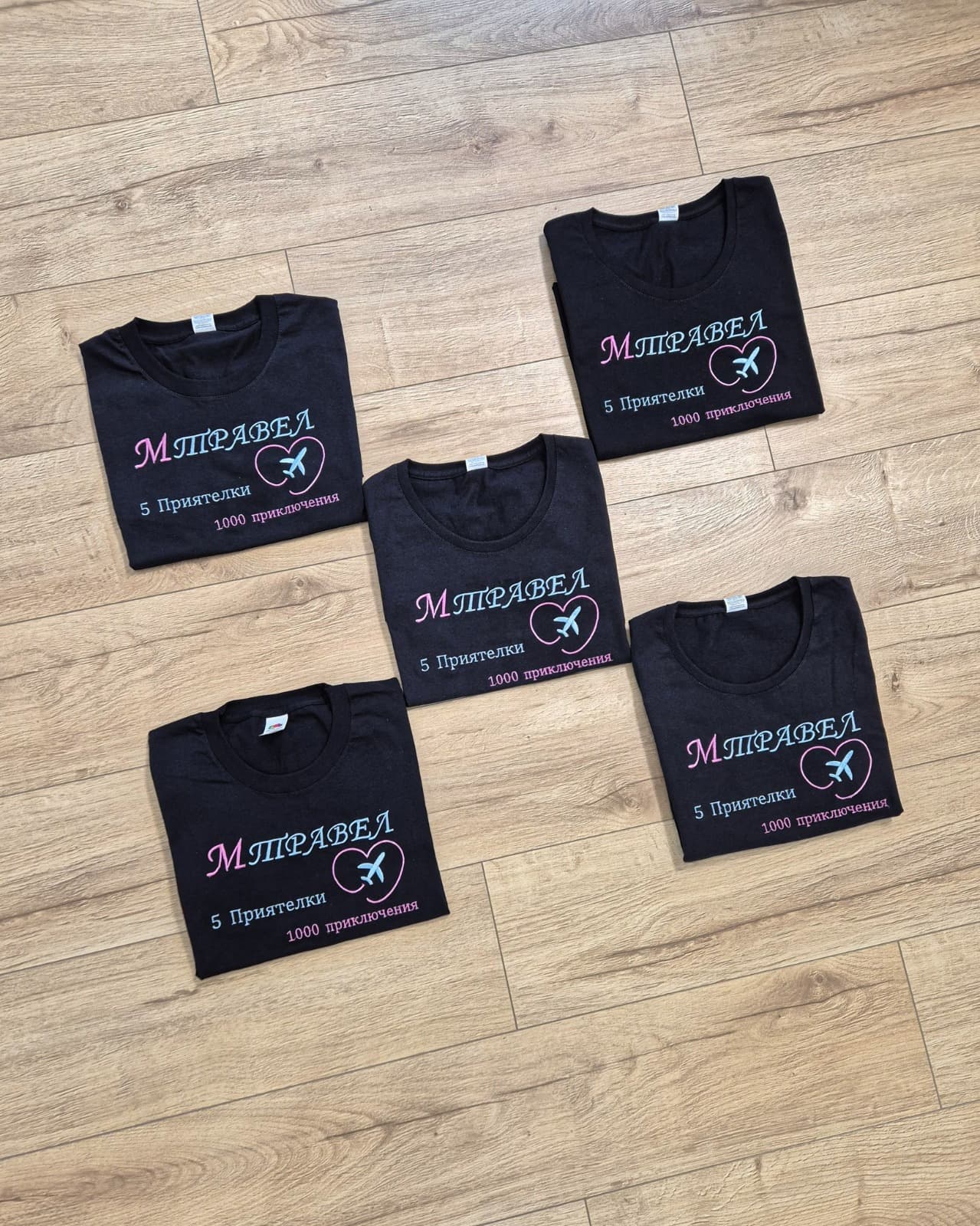 M Travel custom embroidered group t-shirts with heart and plane design