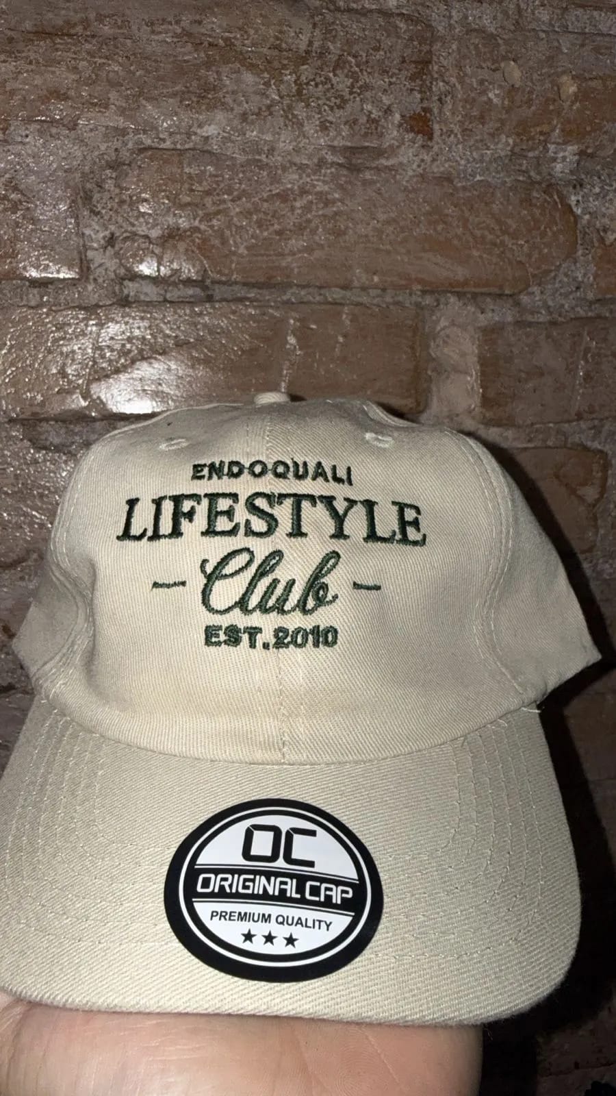 Lifestyle Club cap embroidery sample with front-panel text stitching.